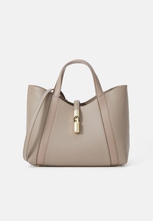 Beige leather tote bag with dual handles, a gold clasp, and structured design featuring contrasting smooth and textured panels.