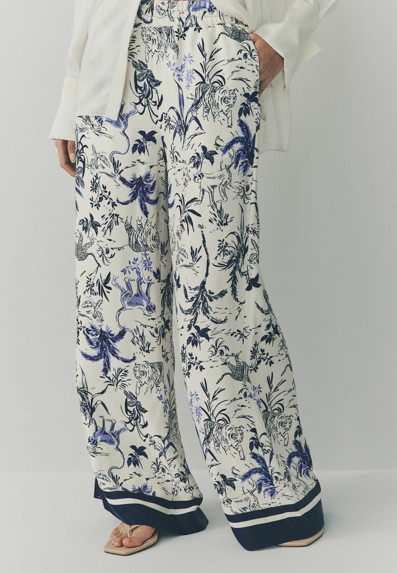 Next Kalhoty - white blue animal print