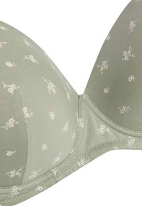 Light green padded bra with small white floral patterns and smooth fabric detailing on cups and band.