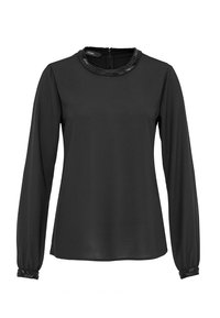Blusa nera a maniche lunghe con scollatura rotonda, caratterizzata da un bordo testurizzato nero attorno al colletto e ai polsini. Tessuto morbido, vestibilità rilassata.
