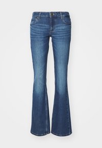 Flared jeans in medium blue denim. Features a zip fly with a metal button, two front pockets, and fading details near the knees.