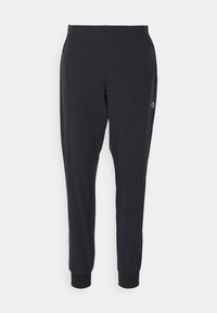 Svarta träningstights med en slät yta, insvängd passform, elastisk midja och muddar vid anklarna. Diskret logotypdetalj på sidan.