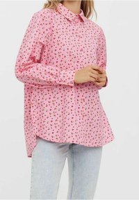 Pink long-sleeve shirt featuring a button-up collar, thin red and gold dot pattern, and a curved hem, made from lightweight fabric.