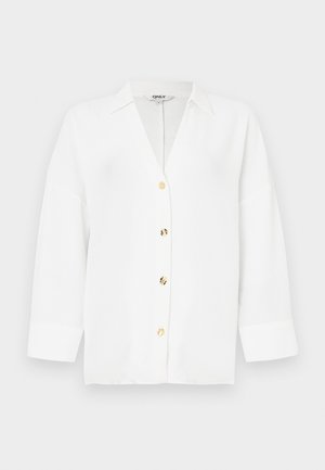 Λευκή ζακέτα με V-λαιμόκοψη και μακριά μανίκια, με χρυσά κουμπιά και άνετη γραμμή. Κατασκευασμένη από ελαφρύ υφασμάτινο ύφασμα με υφή.