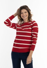 Maglione a righe rosse con strisce orizzontali crema, scollatura rotonda e maniche lunghe, realizzato in morbido materiale a maglia.