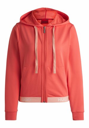 Coral zip-up hoodie with a hood, beige drawstrings, and front pockets. Features a light-colored waistband with "HUGO" logo. Smooth texture.