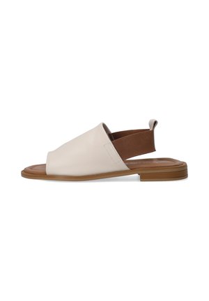 Leather sandal in cream with an open toe, elastic heel strap in brown, and a flat rubber sole. Simple design with smooth texture.