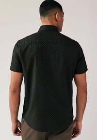 Next Camicia - black gold geometric