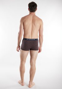 Men's boxer briefs in a dark brown fabric with a subtle leopard print pattern. Features a contrasting waistband with the brand logo.