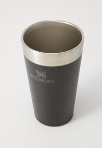 Black stainless steel cup with a smooth matte finish and a polished silver rim. Features a logo printed near the base.