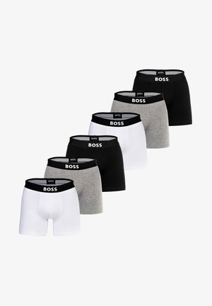 Six pairs of boxer briefs in black, white, and gray. Each features a black waistband with "BOSS" logo. Cotton material with smooth texture.