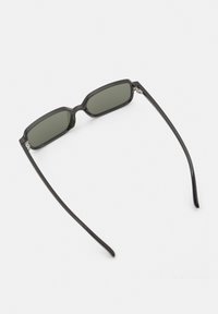 Black rectangular sunglasses with dark green lenses and slim arms. Notable features include a geometric frame design and silver hardware accents.