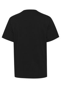 Černé bavlněné tričko s kulatým výstřihem a krátkými rukávy. Zadní strana je jednobarevná bez grafiky či vzorů, s volným střihem.