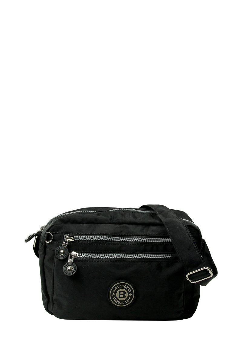 Black synthetic crossbody bag with two zippered pockets, silver accents, adjustable strap, and round logo on the front.