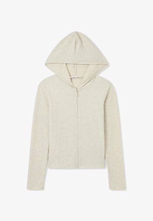 Felpa con zip color beige chiaro realizzata in tessuto a coste. Presenta un cappuccio, maniche lunghe e un design strutturato con una texture liscia.