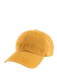 Yellow cotton baseball cap with an embroidered "Timberland" logo and tree design, featuring a curved brim and adjustable strap at the back.