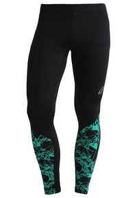 Leggings noirs avec un motif géométrique teal sur le bas des jambes ; fabriqués en tissu extensible pour le confort et la flexibilité ; design épuré.