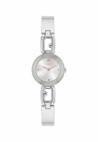 Hõbedane metallkell, millel on ümmargune dial, tekstureeritud äär ja minimalistlikud markerid, samuti lingitud käevõru disain. Bränd "Furla" on nähtav.