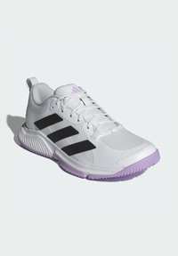 White athletic shoe with black stripes, textured upper, and a light purple sole. Features laces and a pull tab at the heel.