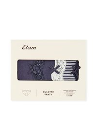 Set di culotte in cotone blu navy con dettagli in pizzo, fiocchi e accenti a righe, confezionato in una cartolina beige con informazioni sul prodotto.