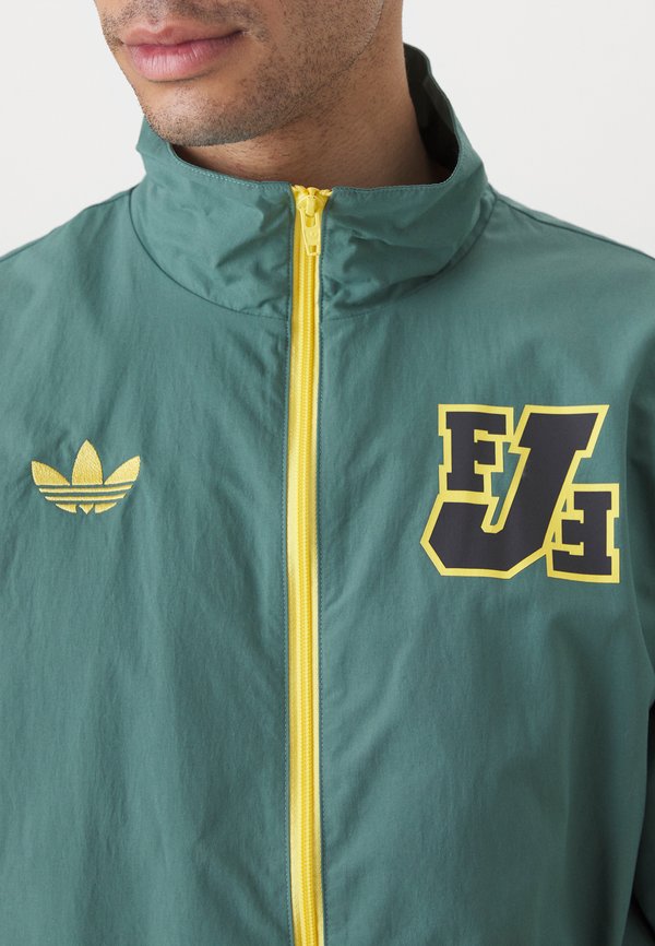 JAMAICA TRACK - National team wear - tech emerald4