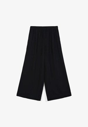 Pantaloni neri a gamba larga con elastico in vita e cordoncino. Tessuto liscio, lunghezza al ginocchio, senza motivi visibili o dettagli metallici.