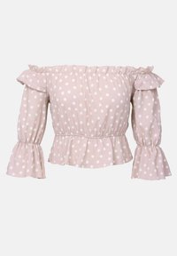 Haut rose clair décolleté avec des pois blancs. Présente des manches volantes et un ourlet peplum. Fabriqué à partir de tissu texturé.