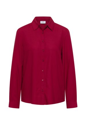 Camicia rossa con bottoni, a maniche lunghe, colletto classico e una texture liscia. Presenta un orlo dritto e bottoni coordinati lungo la parte anteriore.