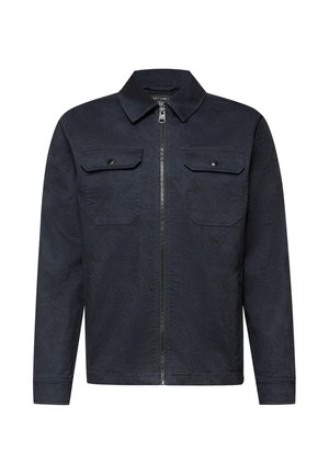 Marineblaue Jacke mit einem strukturierten Muster, zwei Brusttaschen und einem Frontreißverschluss, ausgestattet mit einem klassischen Kragen und langen Ärmeln.