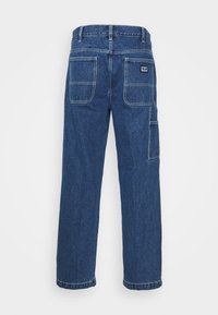 Dark blue denim cargo pants with a straight leg, featuring two back pockets and a side pocket, finished with white stitching details.
