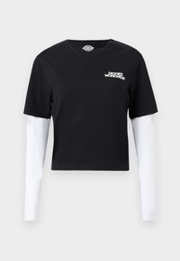 Μαύρο κοντοκομμένο μπλουζάκι με άσπρα μακριά μανίκια και το λογότυπο "Dickies Workwear" στο αριστερό στήθος.