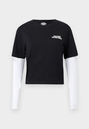 Črna krajšana majica s priloženimi belimi dolgimi rokavi in logotipom "Dickies Workwear" na levi strani prsnega koša.