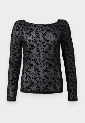 Blusa de manga larga negra con un suave patrón de terciopelo floral, con un escote redondeado y tela transparente.