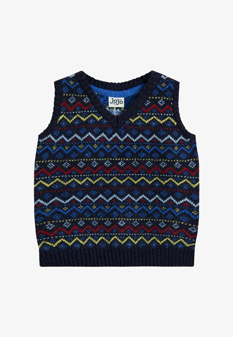 Bezrukávový pletený sveter s výstrihom do V, zdobený mnohofarebným zigzagovým vzorom v tmavomodrej, červenej, modrej, žltej a bielej farbe na tmavom pozadí.
