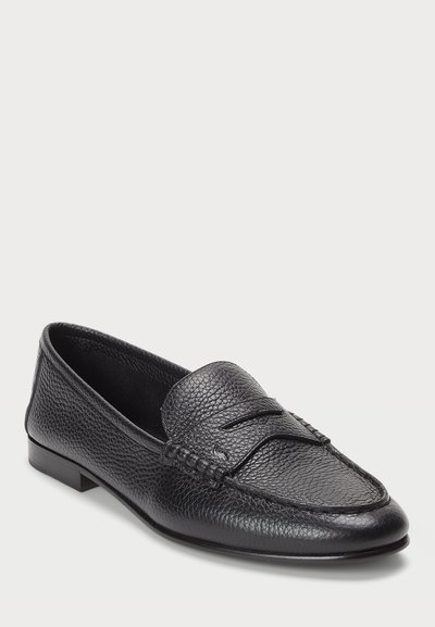 Black leather loafers featuring a textured finish, stitched detailing on the upper, and a low, smooth heel. Classic slip-on design.