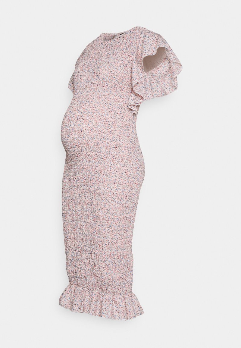 Těhotenské šaty z měkké, elastické látky s růžovým podkladem a malým květinovým vzorem. Mají volánové rukávy a rozšířený lem.