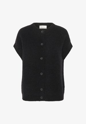 Mustavillainen lyhythihainen neuletakki, joka on valmistettu pehmeästä, tekstuuritunnun omaavasta kankaasta. Takissa on pyöreä kaula-aukko ja kuusi mustaa nappia edessä.