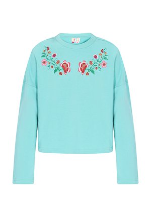 Hele sinine, pika varrukaga pusakas, mis on valmistatud pehmest kangast. Esiosal on roosa ja punase lillekirjaga broderi. Lühendatud disain.