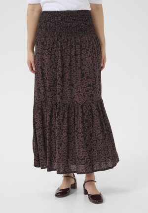 Jupe longue et fluide à motif floral sombre avec une taille smockée et un design à volants. Fabriquée en tissu doux avec un léger éclat.