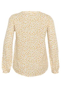 White long-sleeve blouse featuring a scattered mustard yellow and light pink pattern, with a rounded neckline and slightly gathered sleeves.