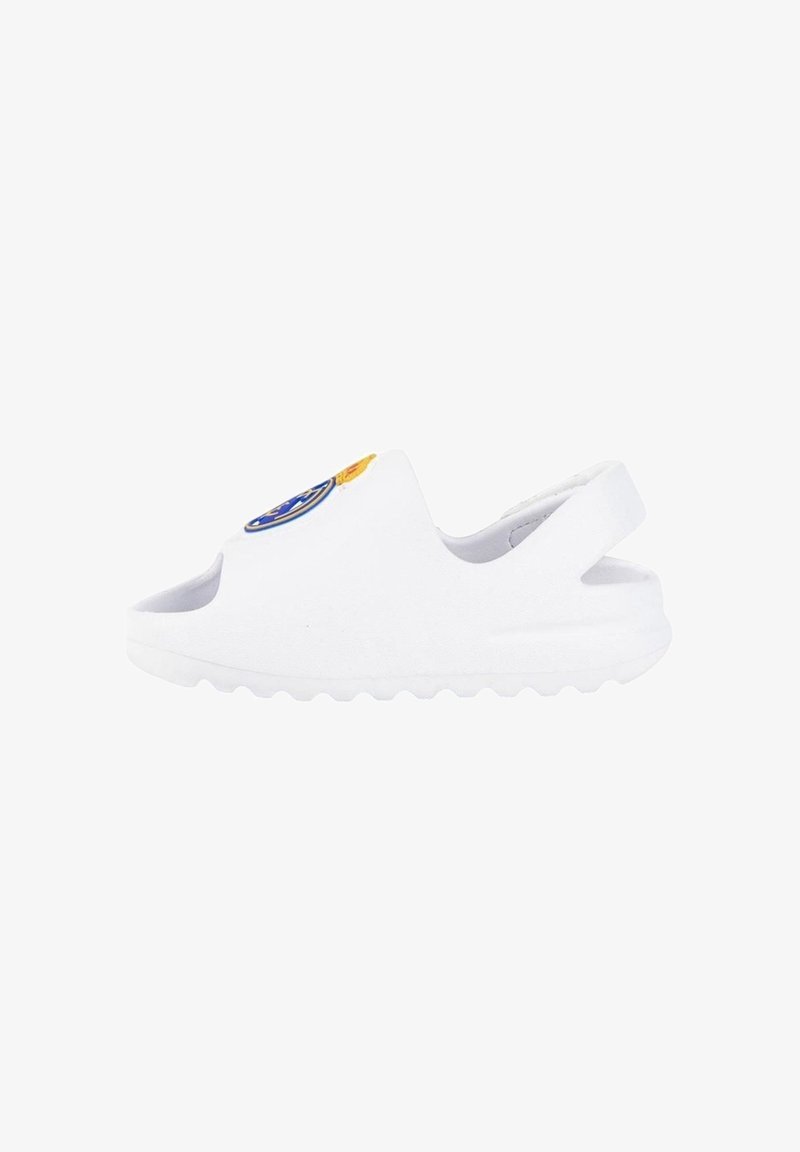 Sabots blancs à enfiler avec un bout rond et un talon ouvert. Dotés d'une semelle texturée et d'un patch logo circulaire avec des accents bleus et oranges.