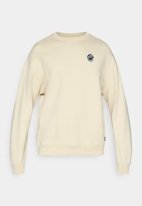 Φούτερ σε κρεμ απόχρωση με άνετη εφαρμογή, ριμπ μανσέτες και κεντημένο μαύρο λογότυπο στο στήθος. Μαλακό, υφασμένο ύφασμα.