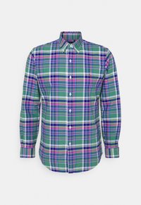 Green plaid shirt with long sleeves, button-down collar, featuring purple, blue, and white checks, and a small embroidered logo on the chest.