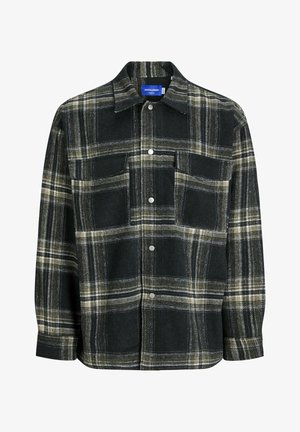Black and green plaid flannel shirt with button closure, two chest pockets, and a pointed collar. Textured fabric with contrasting white lines.