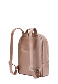 Rose gold leather backpack with a textured finish, featuring adjustable straps, a top handle, and a zippered compartment.