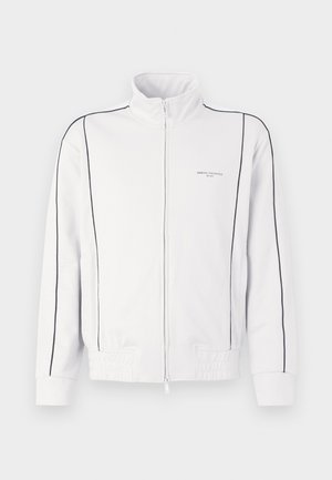 Giacca a track bianca con zip, dettagli neri sulle maniche e sul davanti, vita elastica e piccolo logo Armani Exchange sul lato sinistro del petto.