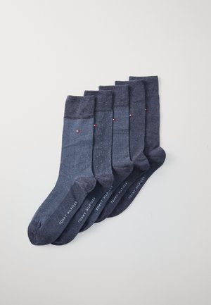 Dunkelblaue Baumwollsocken im Set, die verschiedene Muster wie Fischgrät und Pünktchen zeigen. Jede Socke hat einen gerippten Bund und ein Markenlogo.