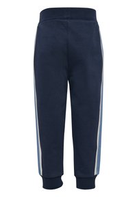 Marina blöjor med ribbad midja, avsmalnande manschetter och ljusgrå sidan ränder. Mjuk tyg med en slät textur.