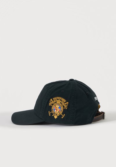 Black baseball cap with embroidered colorful Polo Ralph Lauren crest on side and adjustable brown leather strap at back.