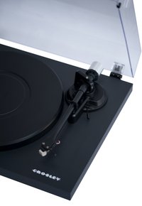 Black turntable with a matte finish, a circular platter, black tonearm, and transparent dust cover. Features adjustable speed control and branding.